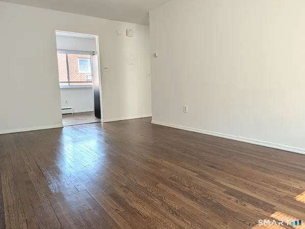 a kitchen with a sink and refrigerator