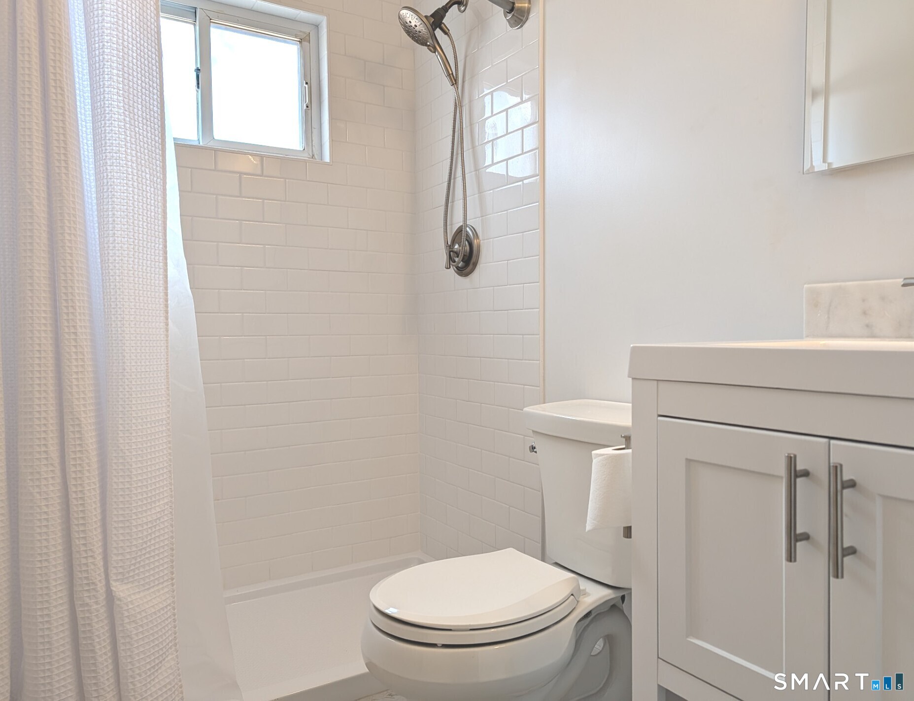 18 Prospect Street, Unit C10 Norwalk, CT 06850 - Photo 7 of 11 a white toilet sitting next to a bathroom sink