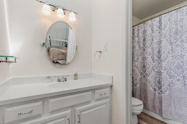 a bathroom with a sink and mirror