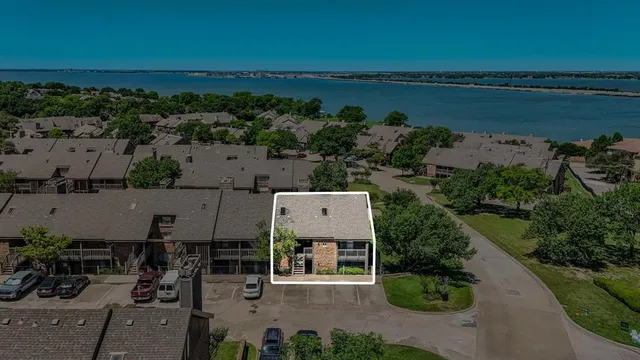 an aerial view of a house with outdoor space