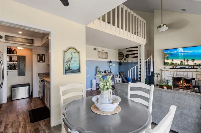 a dining room with furniture and wooden floor
