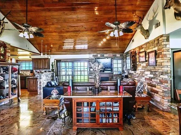 a large room with lots of wooden furniture