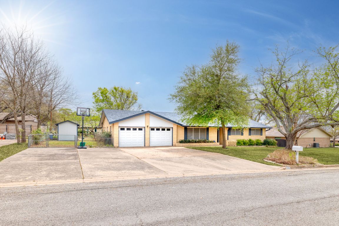 307 7th Street Pflugerville, TX 78660 - Photo 1 of 1 a view of a house with a yard