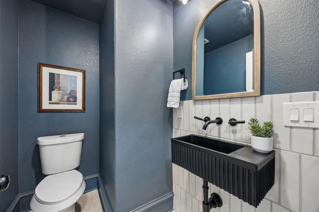 1260 Stacy Road Fairview, TX 75069 - Photo 22 of 40 Half bath on first floor with low flow commode
