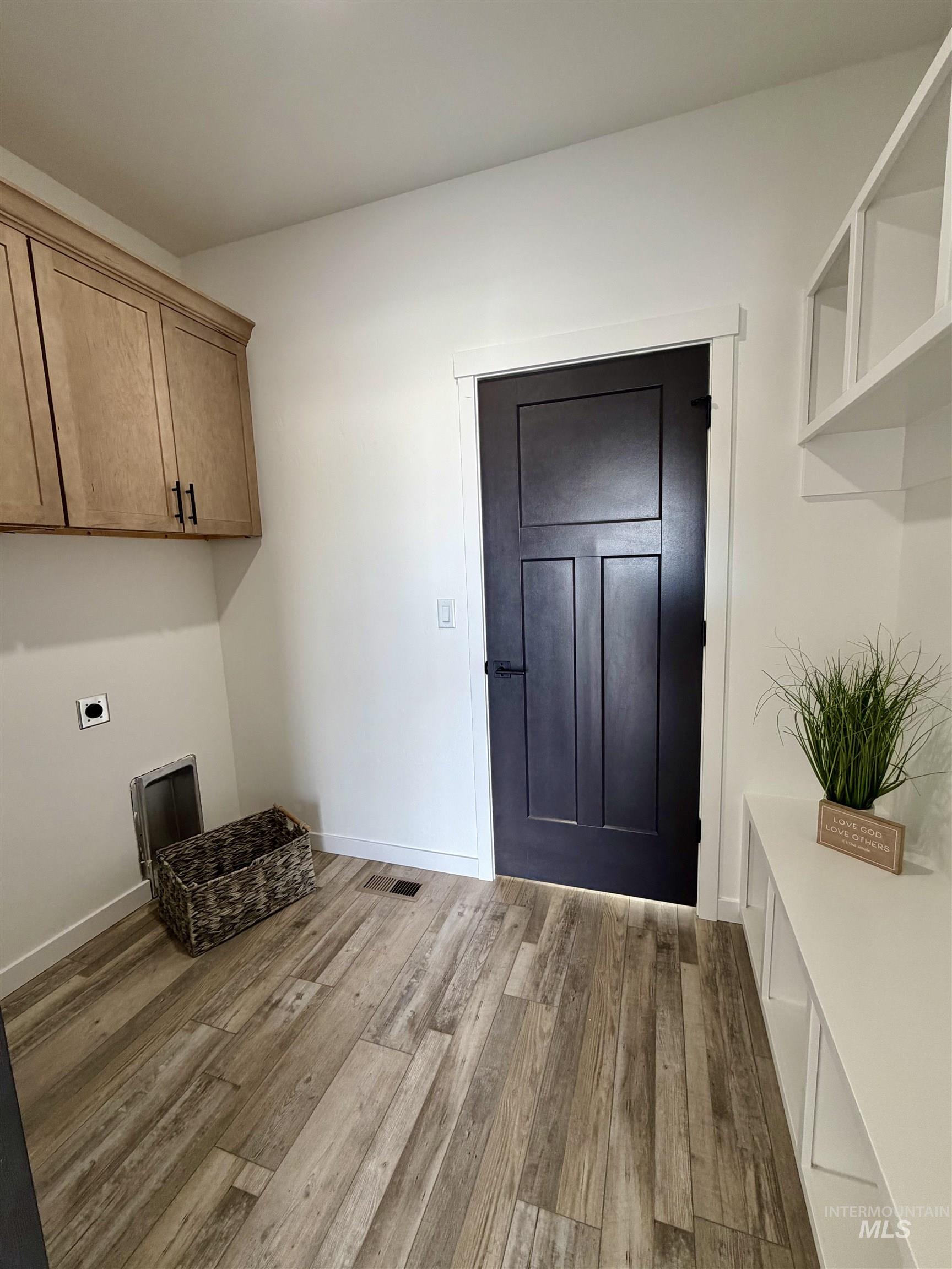 1419 Topaz Rupert, ID 83350 - Photo 16 of 41 Laundry room featuring cabinet space, light wood-style floors, and electric dryer hookup
