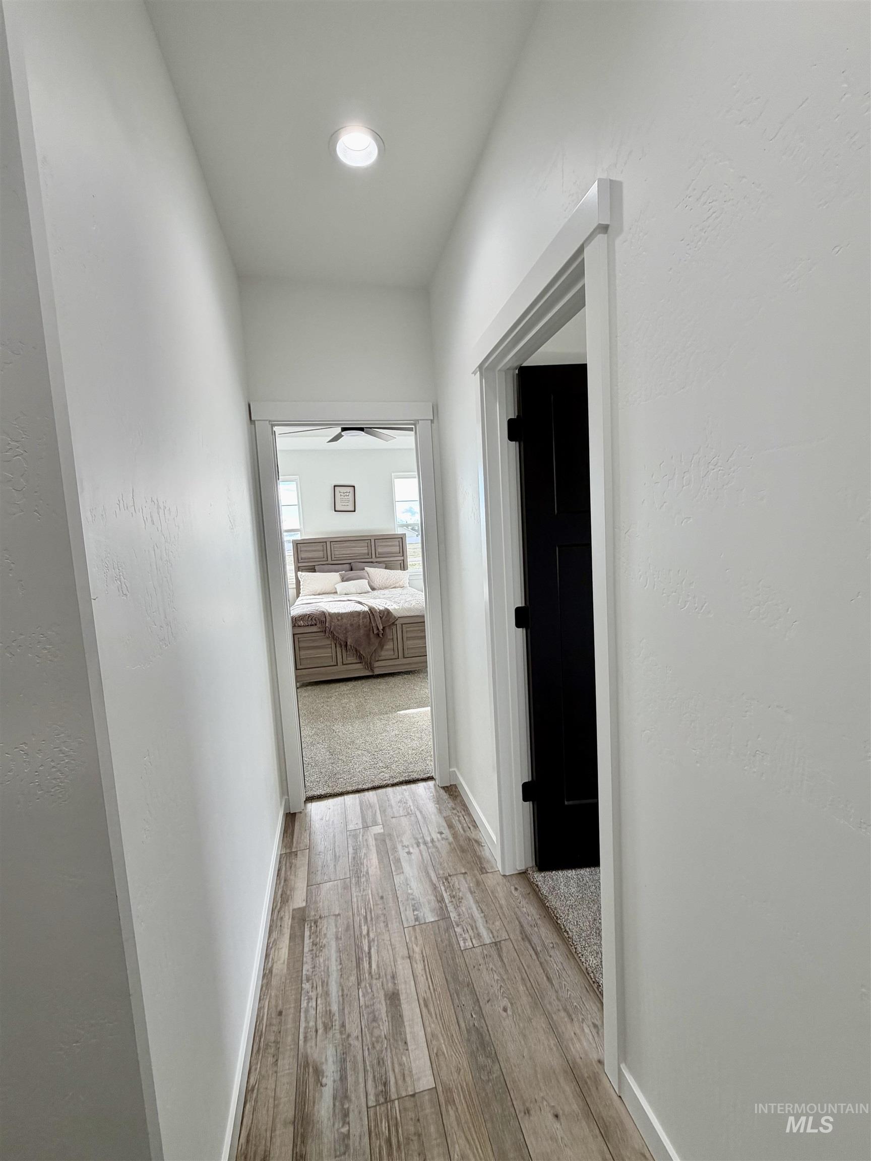 1419 Topaz Rupert, ID 83350 - Photo 18 of 41 Corridor with light wood-type flooring and a textured wall