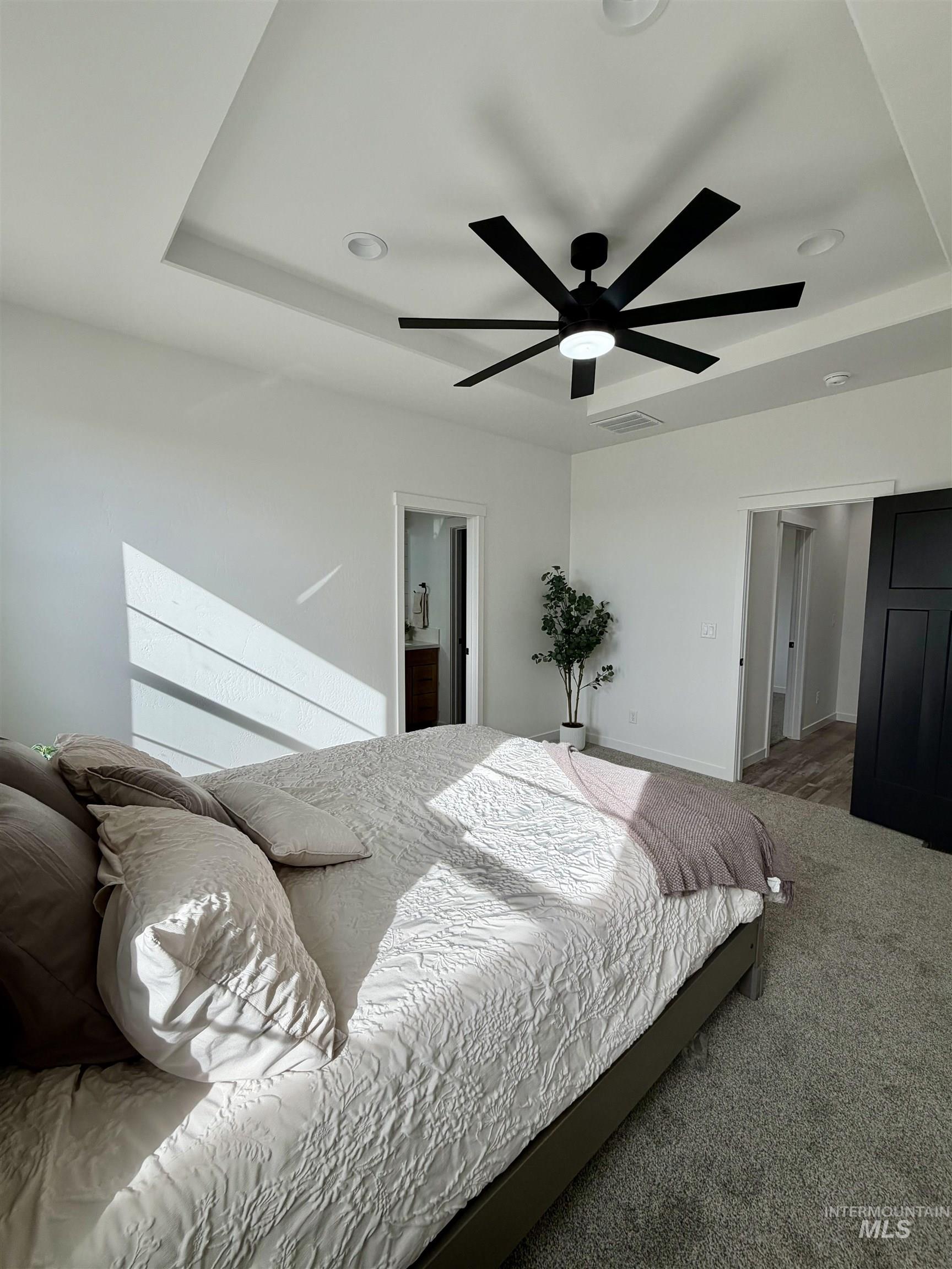 1419 Topaz Rupert, ID 83350 - Photo 20 of 41 Carpeted bedroom with a raised ceiling, recessed lighting, and a ceiling fan