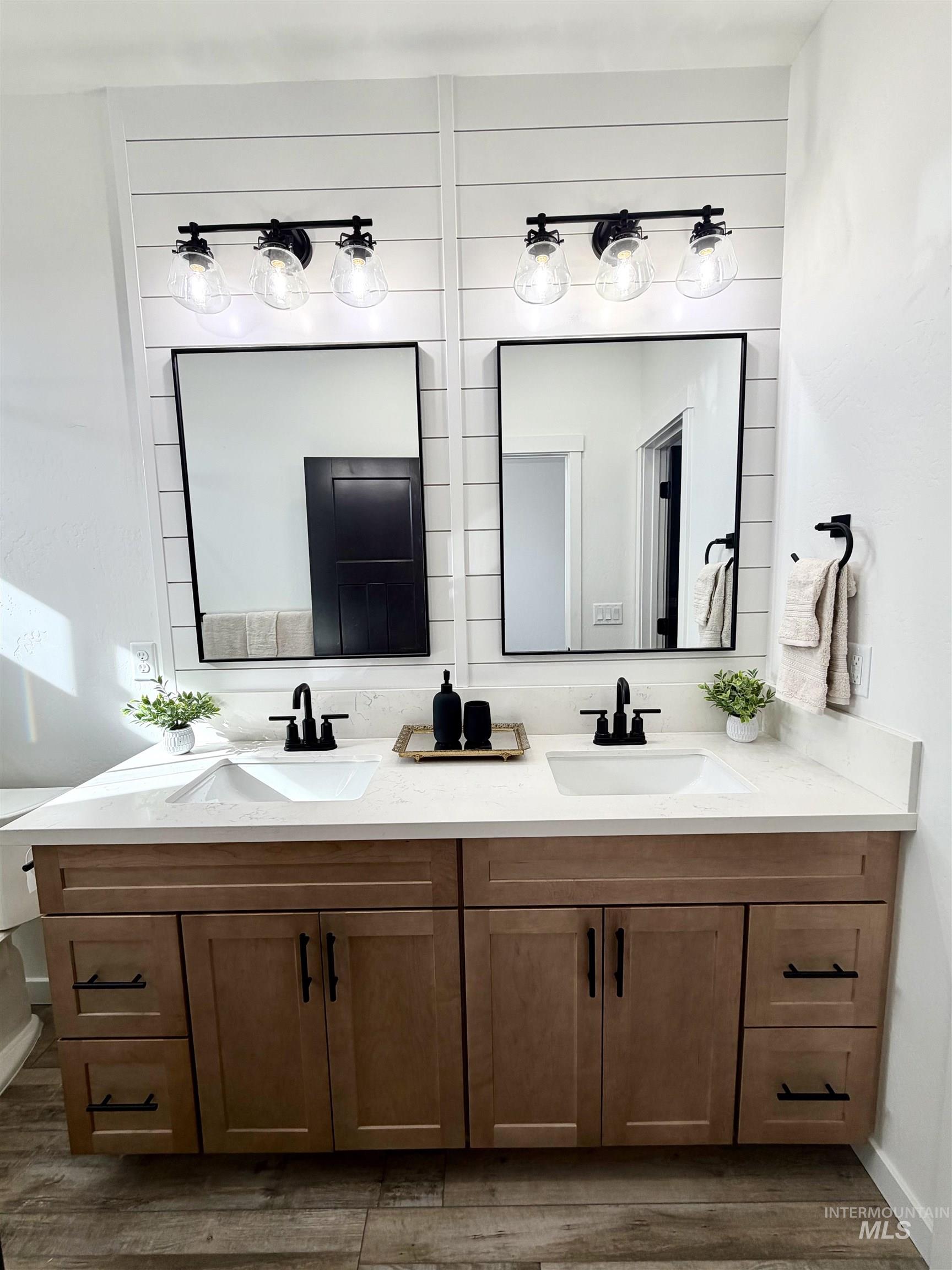 1419 Topaz Rupert, ID 83350 - Photo 22 of 41 Full bath with double vanity and dark wood finished floors