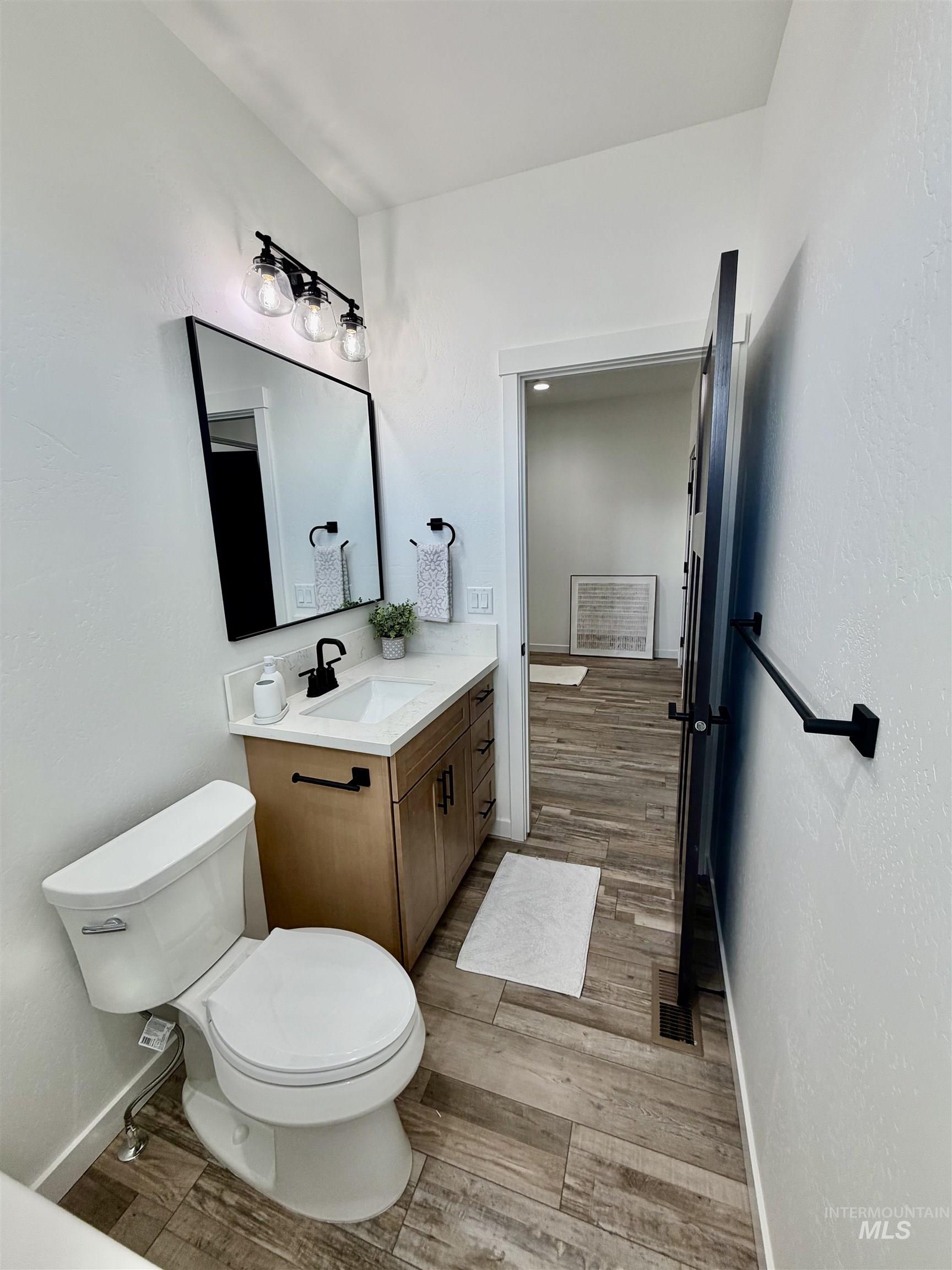 1419 Topaz Rupert, ID 83350 - Photo 28 of 41 Bathroom with vanity and light wood finished floors