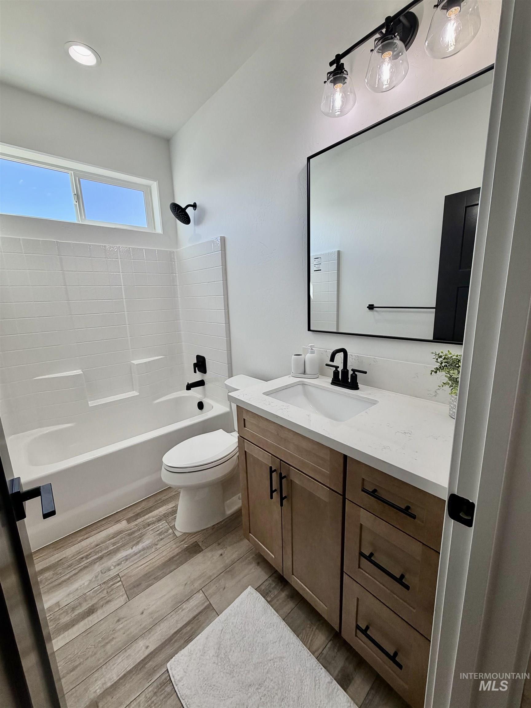 1419 Topaz Rupert, ID 83350 - Photo 29 of 41 Bathroom featuring vanity, bathtub / shower combination, and light wood finished floors