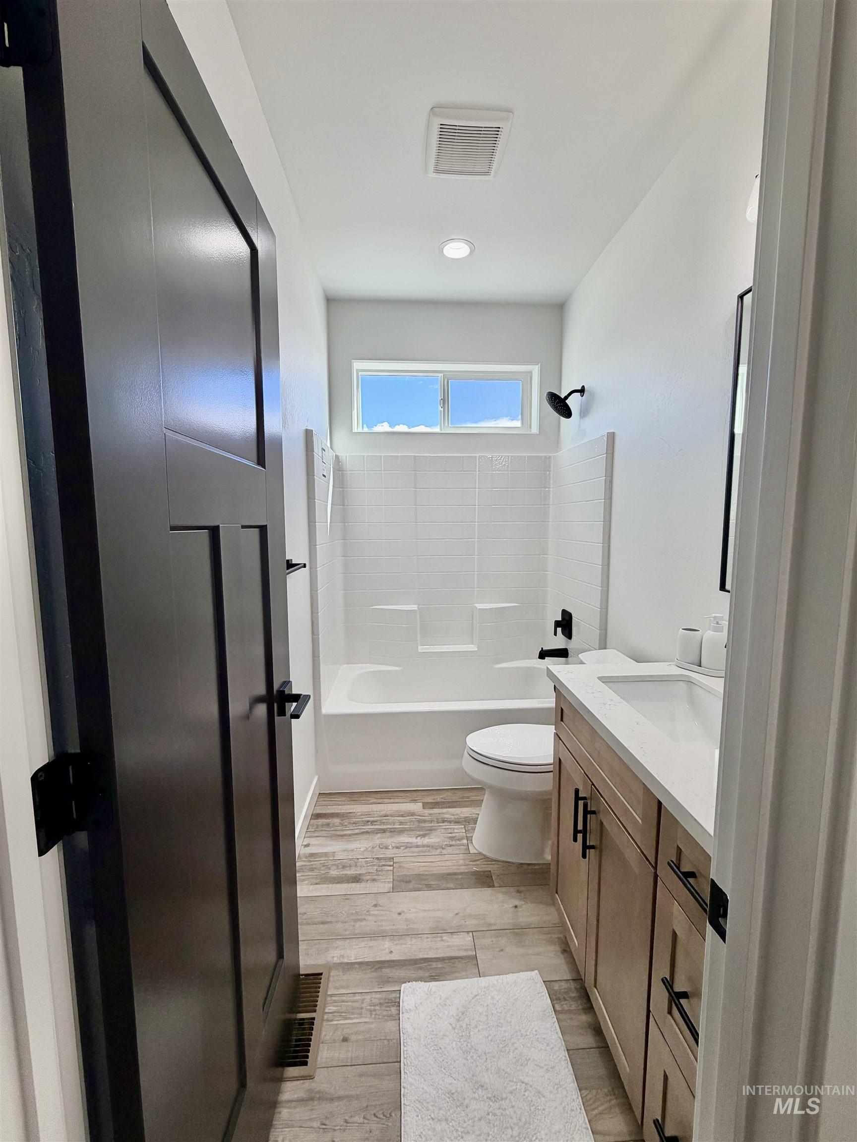 1419 Topaz Rupert, ID 83350 - Photo 30 of 41 Full bath featuring vanity, shower / washtub combination, and light wood-type flooring