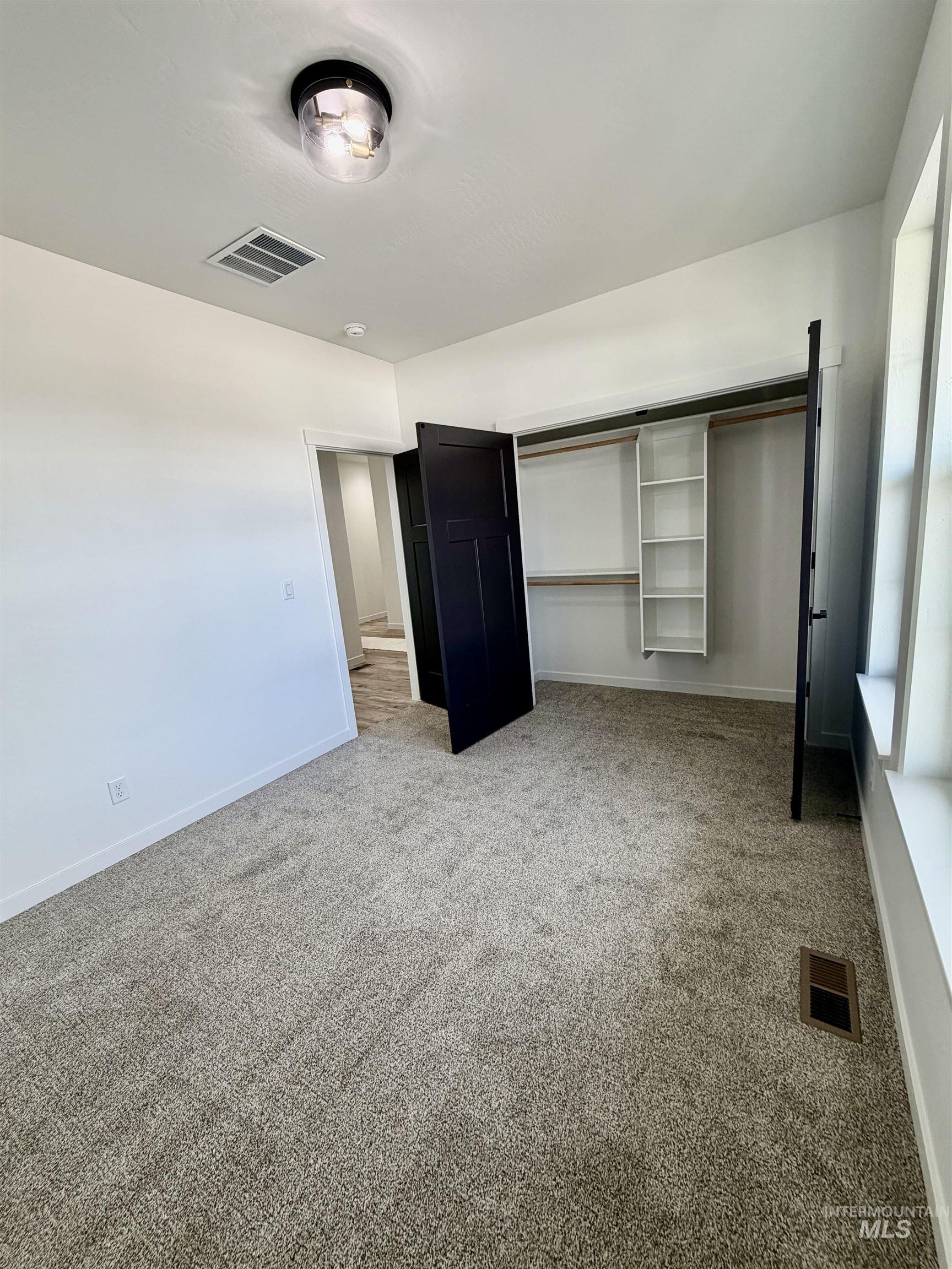 1419 Topaz Rupert, ID 83350 - Photo 31 of 41 Unfurnished bedroom with carpet and a closet