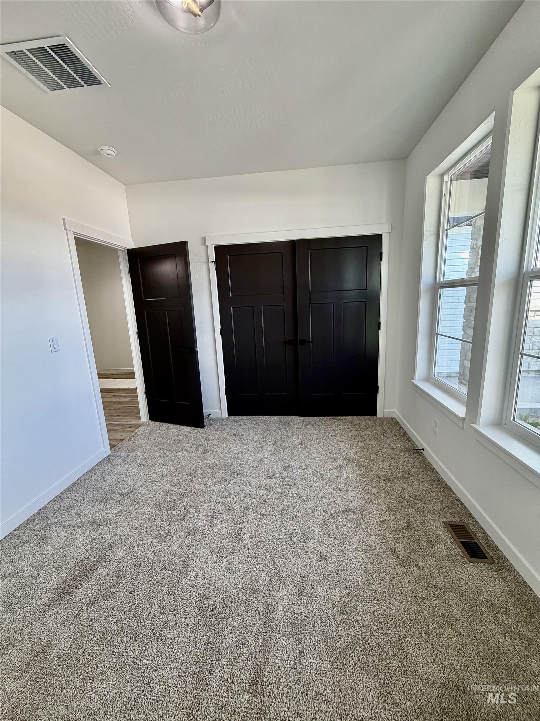 1419 Topaz Rupert, ID 83350 - Photo 32 of 41 Unfurnished bedroom featuring carpet and a closet