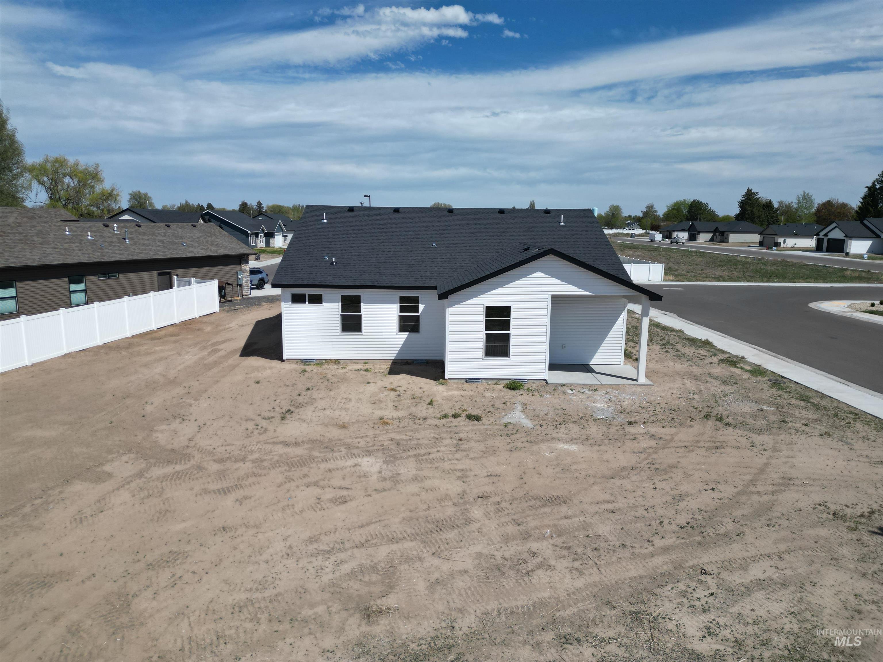 1419 Topaz Rupert, ID 83350 - Photo 33 of 39 Contemporary single-story residence featuring white siding and a dark shingle roof