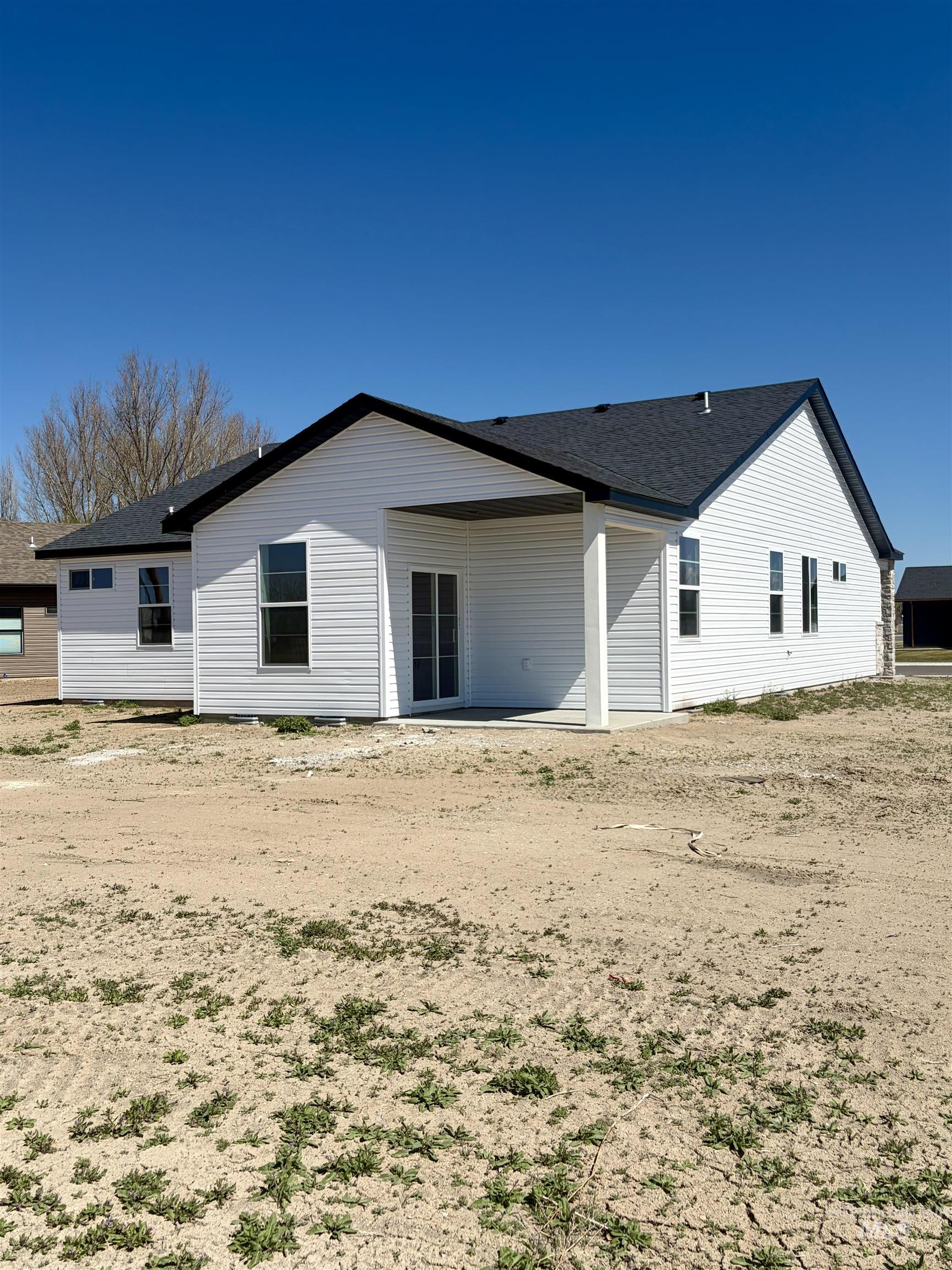 1419 Topaz Rupert, ID 83350 - Photo 37 of 41 Back of property featuring a patio area and roof with shingles