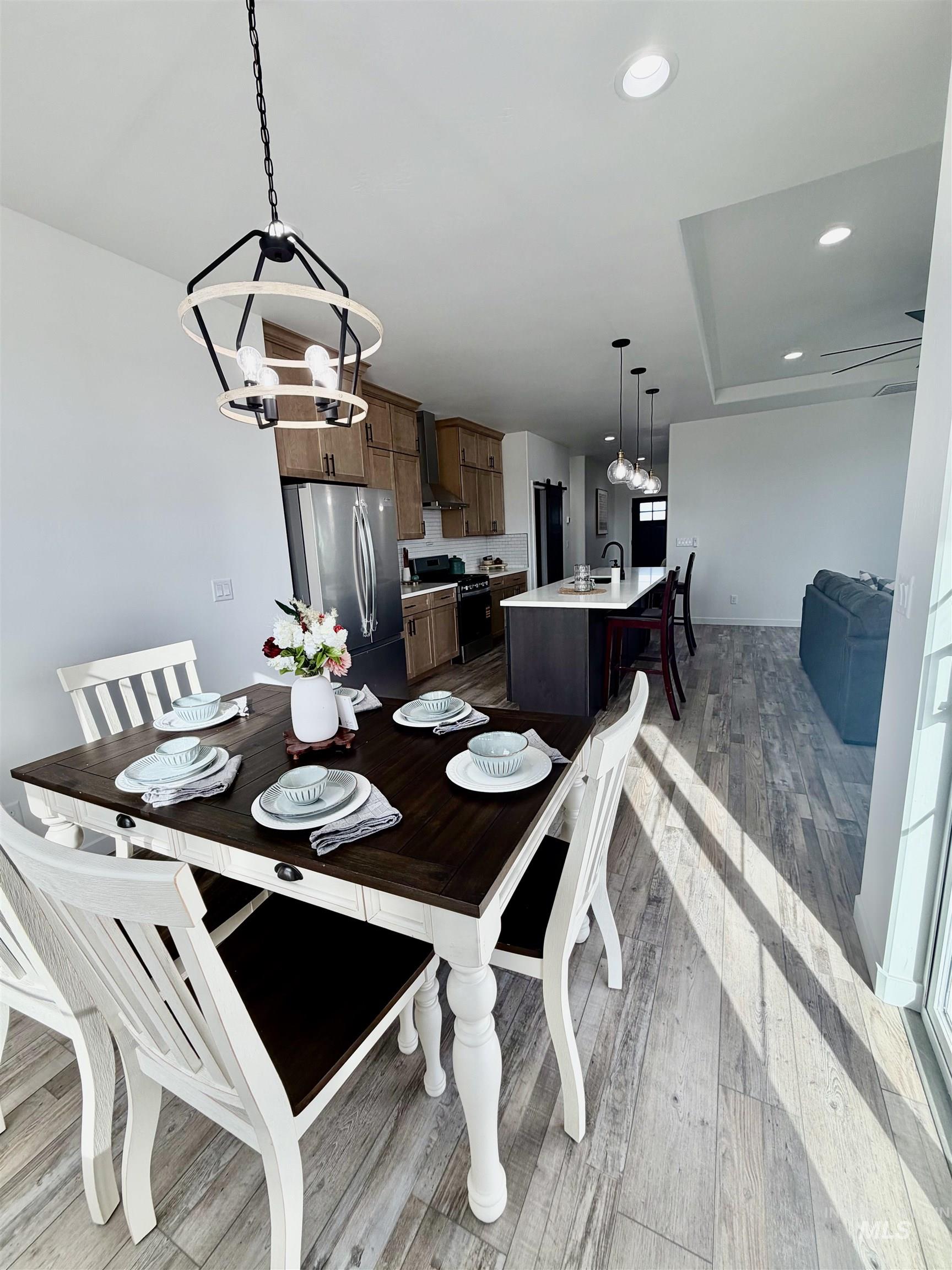 1419 Topaz Rupert, ID 83350 - Photo 7 of 41 Dining space with light wood-type flooring and a chandelier
