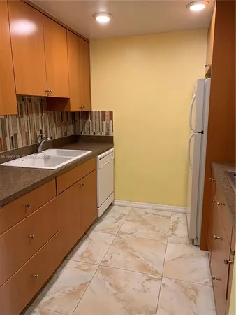a view of kitchen and utility room