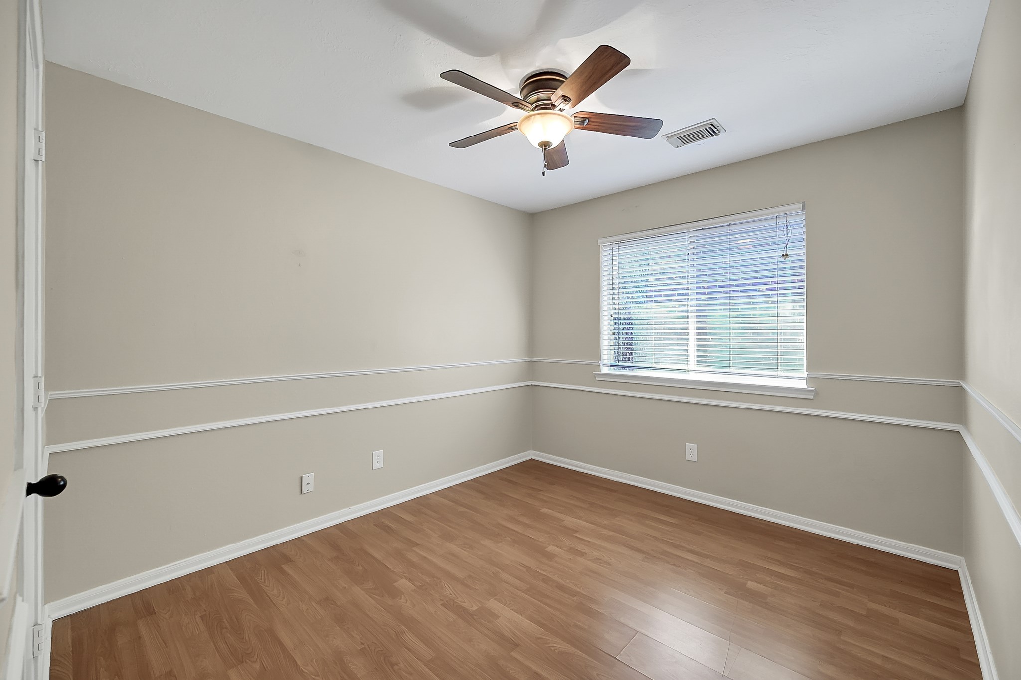 222 Lazy Lane Montgomery, TX 77356 - Photo 12 of 18 wooden floor in an empty room with a window