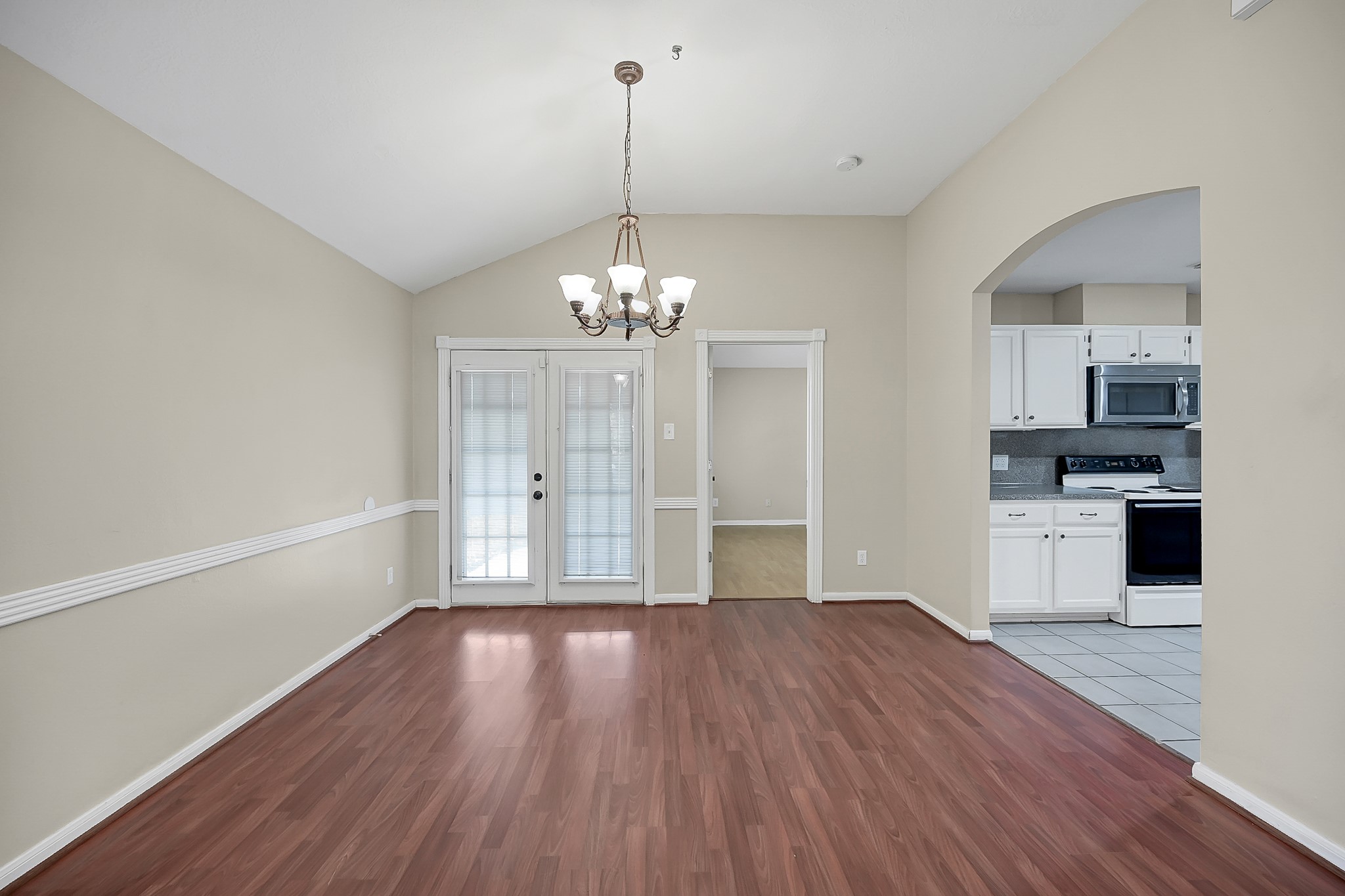 222 Lazy Lane Montgomery, TX 77356 - Photo 6 of 18 a view of a kitchen with stove and cabinets