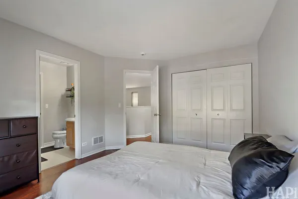 a bedroom with a bed and closet