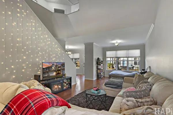 a bedroom with furniture and a flat screen tv