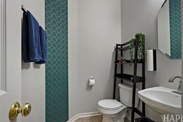 a bathroom with a toilet and a sink