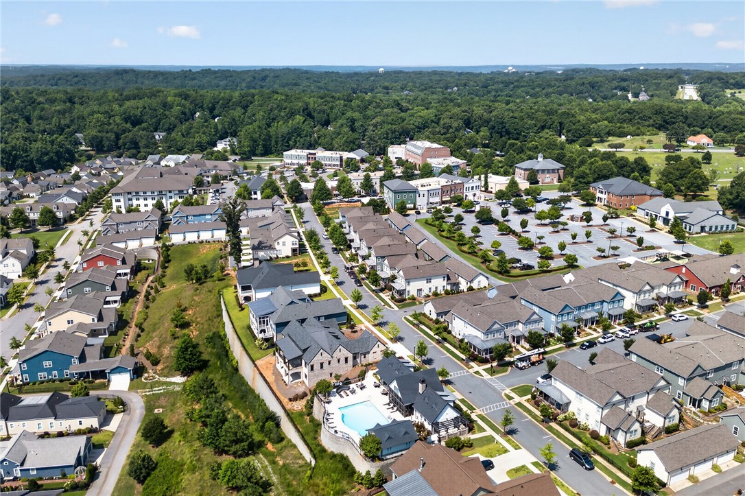 112 Tuttle Street Clemson, SC 29631 - Photo 31 of 46 An aerial perspective reveals a vibrant community with diverse housing, green spaces, and a refreshing outdoor pool.