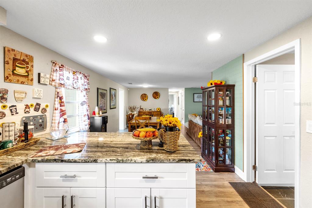 2152 Arcadia Road Holiday, FL 34690 - Photo 12 of 30 a living room with granite countertop furniture and a wooden floor
