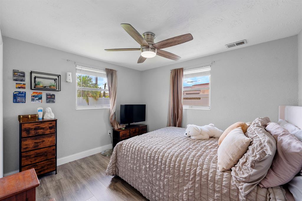 2152 Arcadia Road Holiday, FL 34690 - Photo 15 of 30 a bedroom with a bed and a television