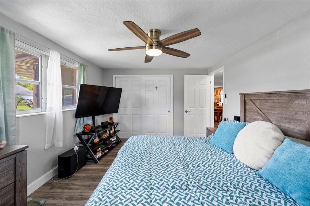 2152 Arcadia Road Holiday, FL 34690 - Photo 17 of 30 a bedroom with a bed and a flat screen tv