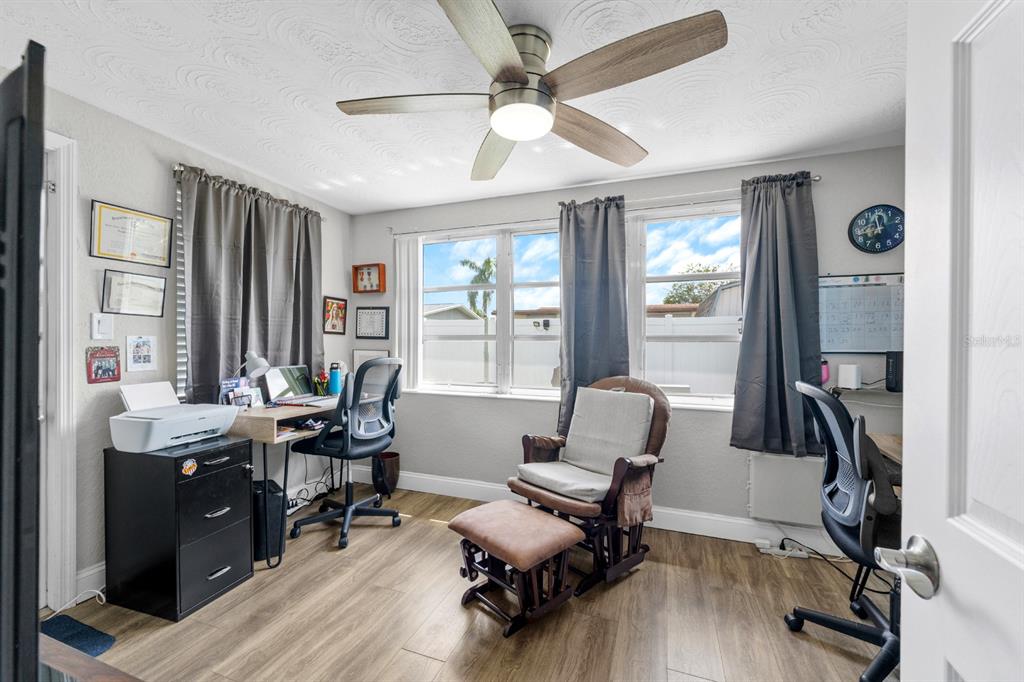 2152 Arcadia Road Holiday, FL 34690 - Photo 19 of 30 a view of a workspace with furniture and a window