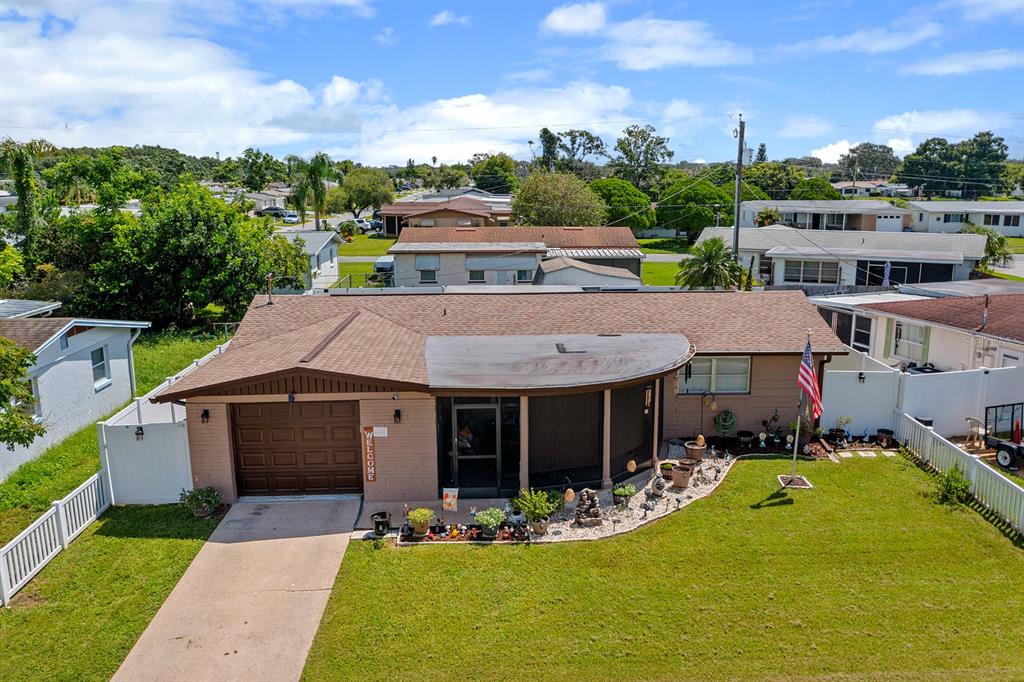 2152 Arcadia Road Holiday, FL 34690 - Photo 25 of 30 a view of a house with garden and porch