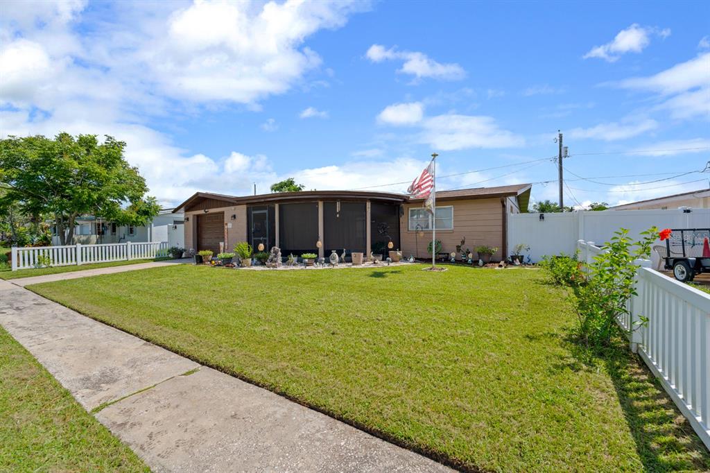 2152 Arcadia Road Holiday, FL 34690 - Photo 3 of 30 a front view of house with yard and green space