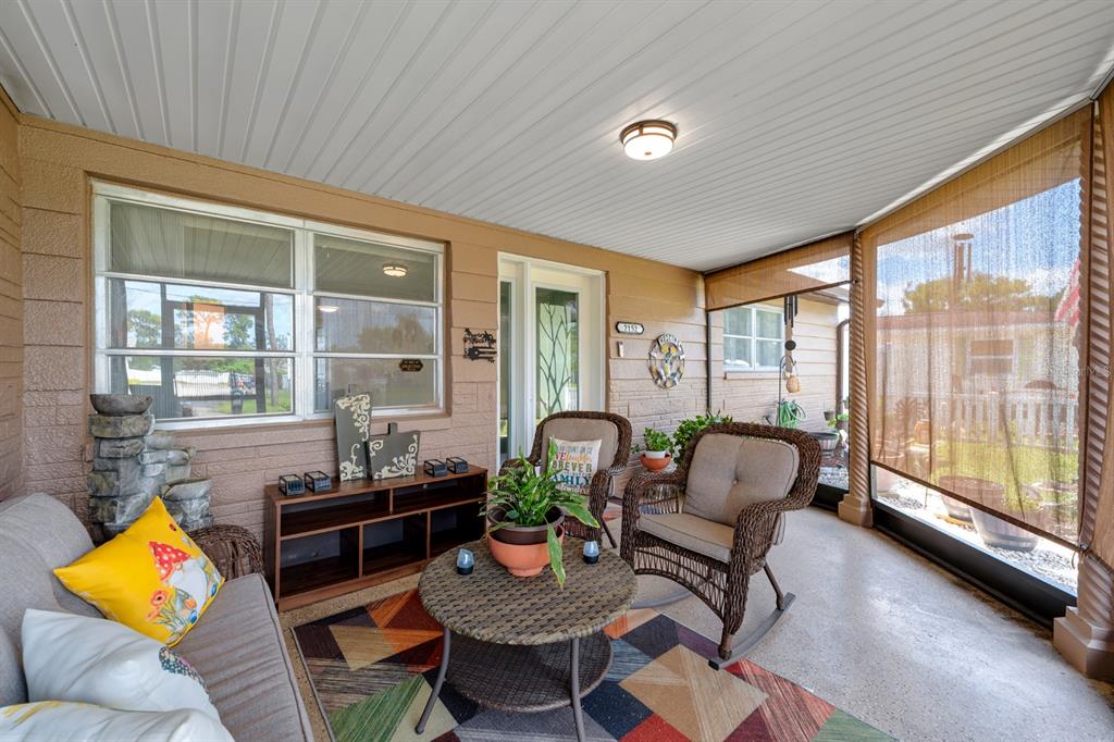 2152 Arcadia Road Holiday, FL 34690 - Photo 4 of 30 a living room with furniture and a large window