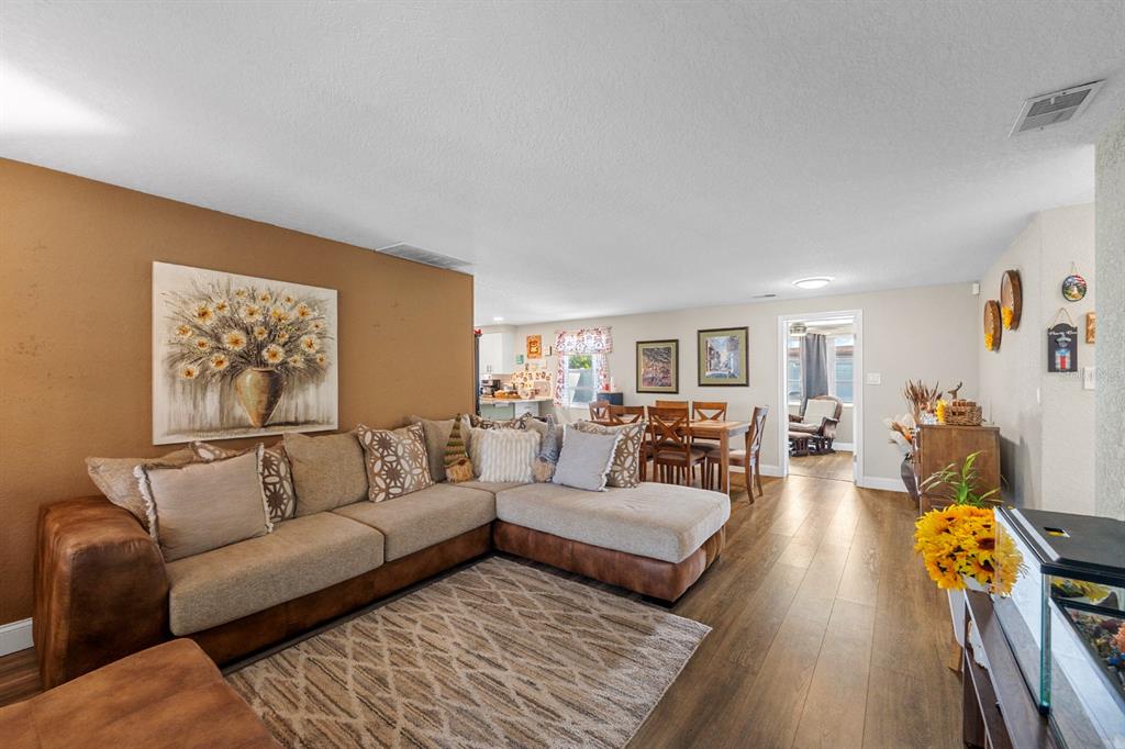 2152 Arcadia Road Holiday, FL 34690 - Photo 5 of 30 a living room with furniture and wooden floor