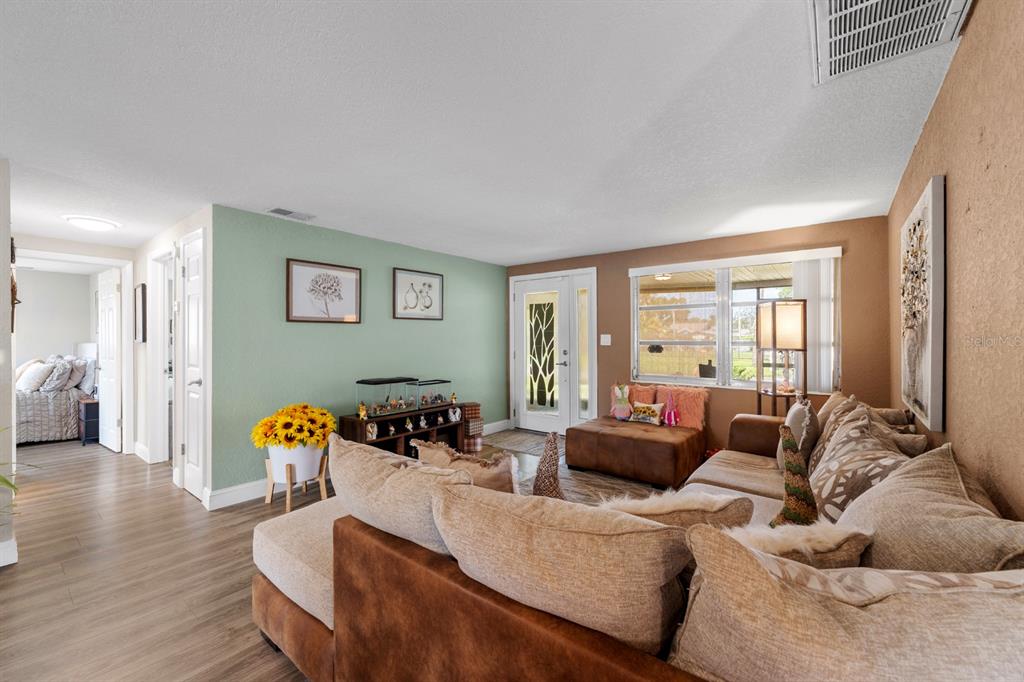 2152 Arcadia Road Holiday, FL 34690 - Photo 6 of 30 a living room with furniture and a large window