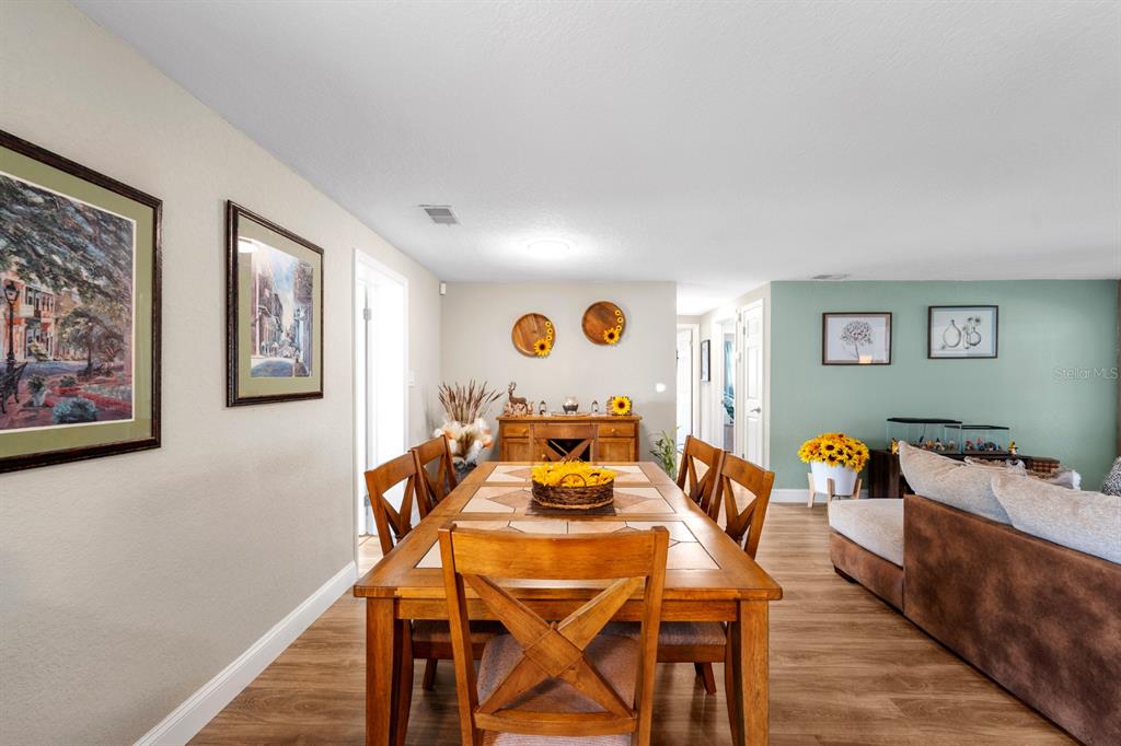 2152 Arcadia Road Holiday, FL 34690 - Photo 8 of 30 a dining room with furniture and wooden floor