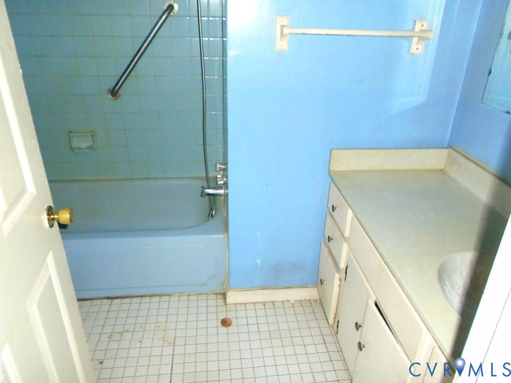 16203 West Patrick Henry Road Montpelier, VA 23192 - Photo 12 of 23 Bathroom featuring a tub with a tiled surround, a