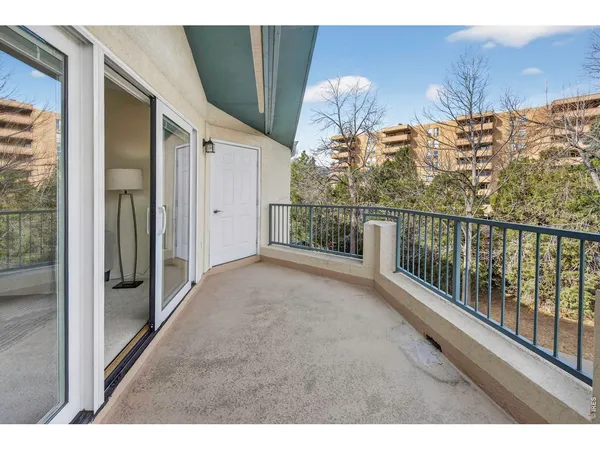 a view of balcony with furniture