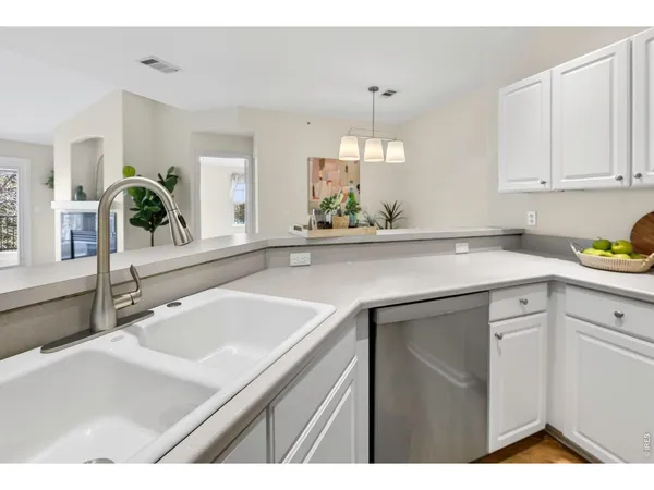 a kitchen with a sink and cabinets