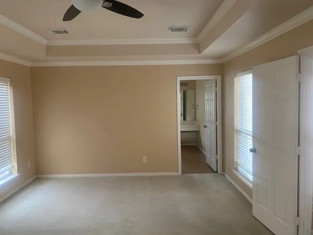 an empty room and a bathroom