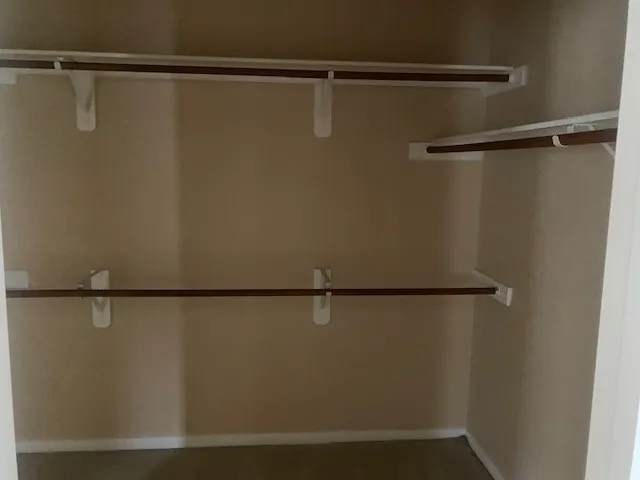 a view of an empty room and a window