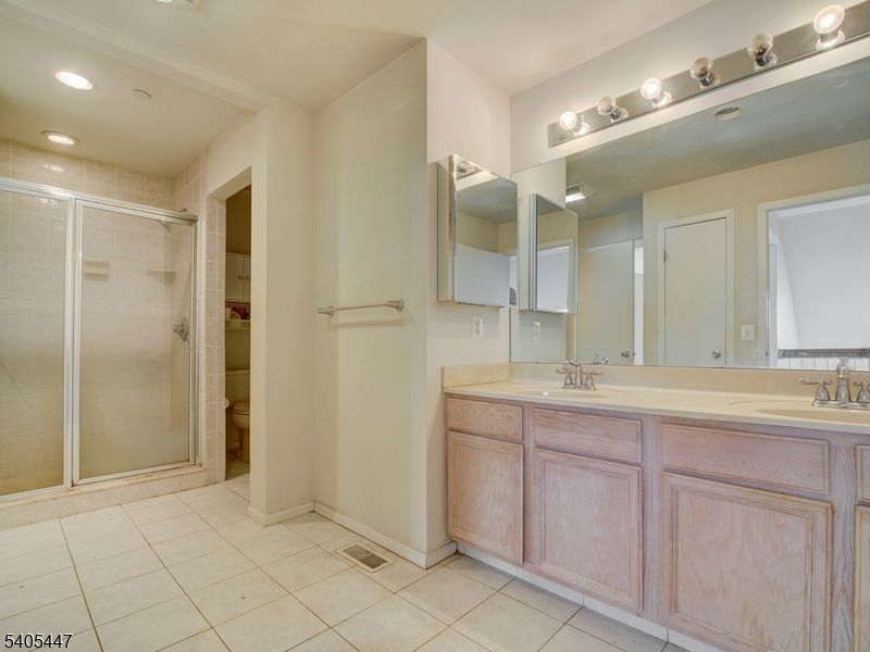 30 Pasture Court Ledgewood, NJ 07852 - Photo 20 of 24 a bathroom with a double vanity sink and a mirror