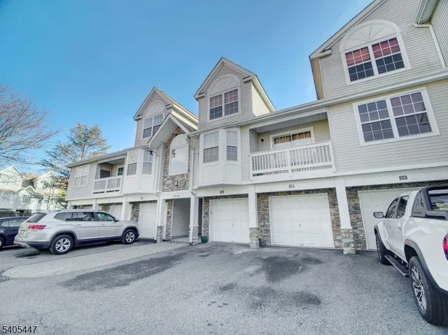 a view of a car park in front of house