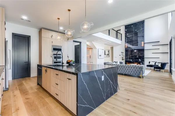 a large room with kitchen island granite countertop lots of counter top space