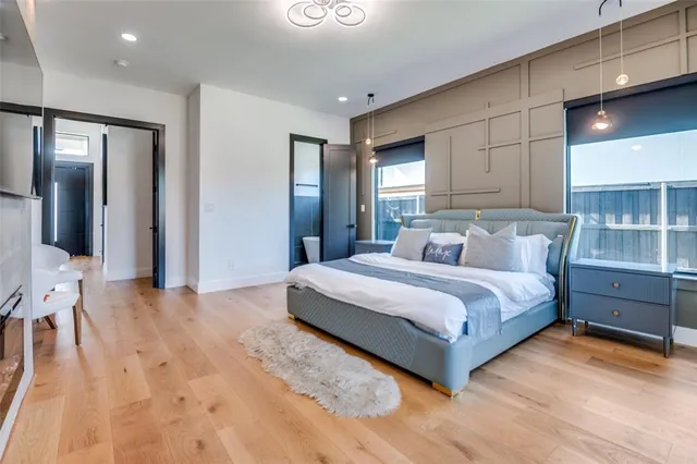 a bedroom with a bed and a night stand