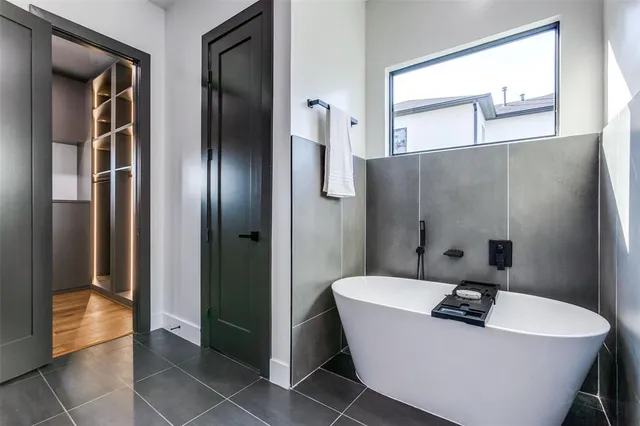 a bathroom with a sink a mirror and a bathtub