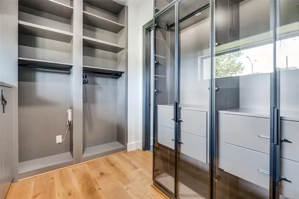 a bathroom with a shower and a glass door