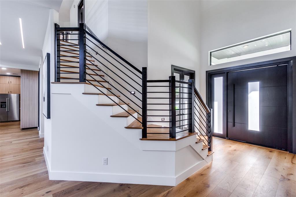 10923 Marsh Lane Dallas, TX 75229 - Photo 3 of 40 a view of entryway and hall with wooden floor