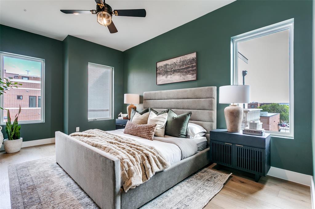 250 East Dallas Road, Unit 121 Grapevine, TX 76051 - Photo 23 of 34 a bedroom with bed and wooden floor